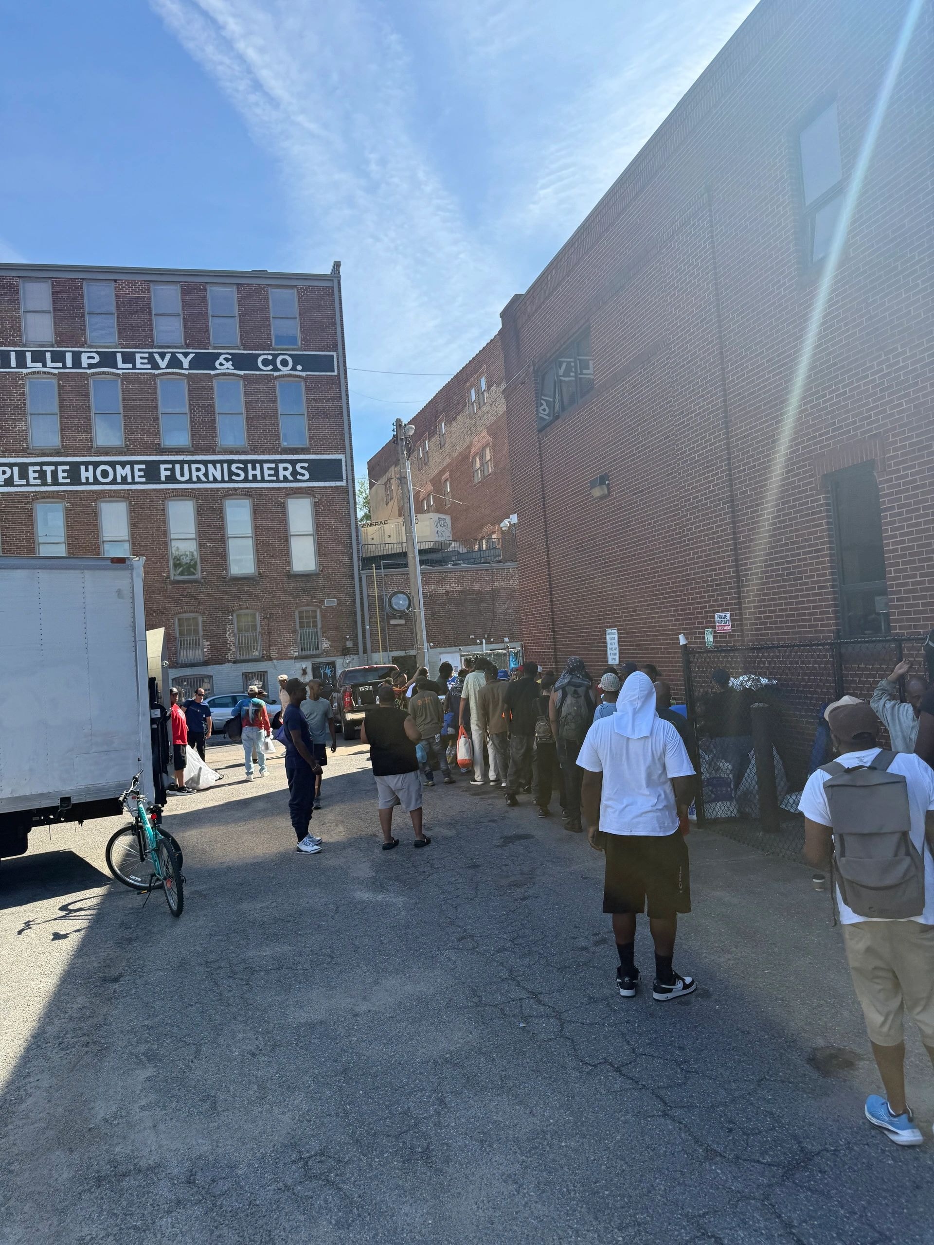 Community members joining hands together